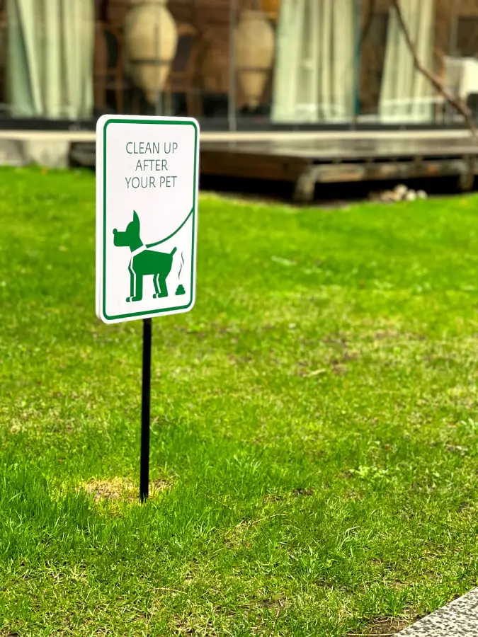 Clean up after your pet sign in local green space