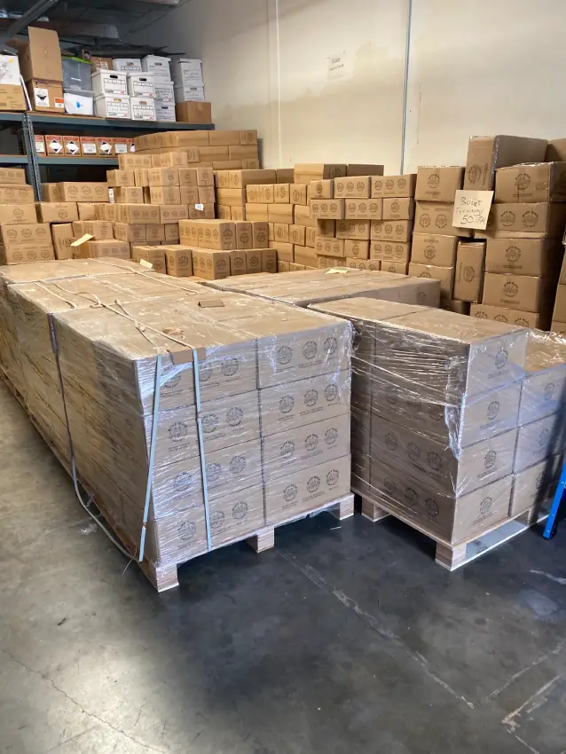 Pallets of Ruff Ruff Poop Bags in warehouse